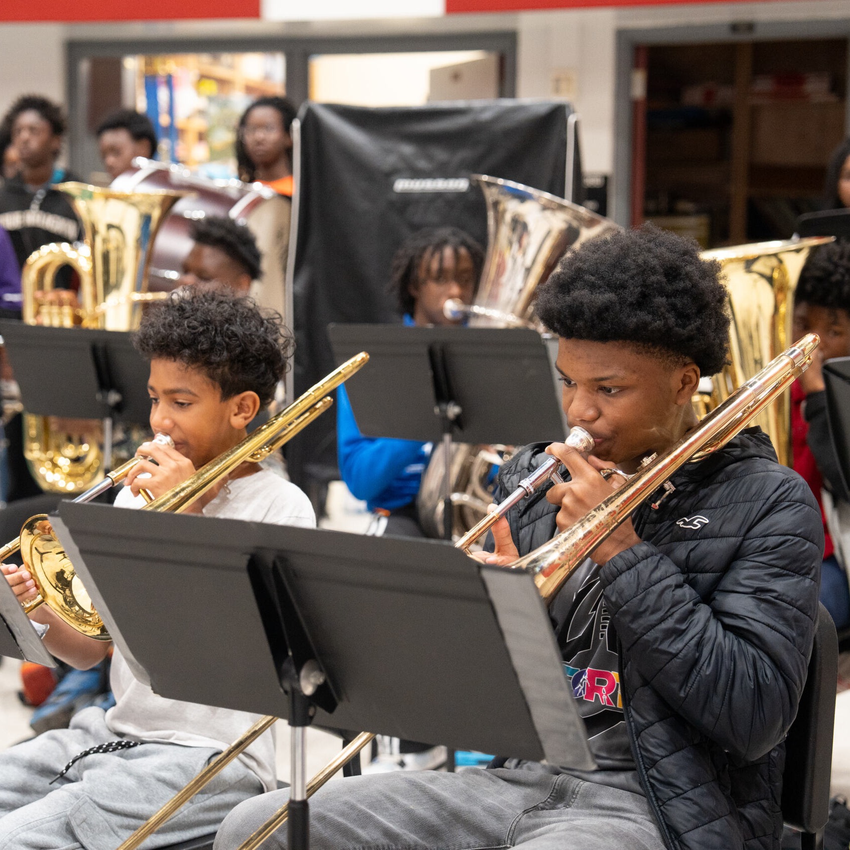 Students playing the trombone