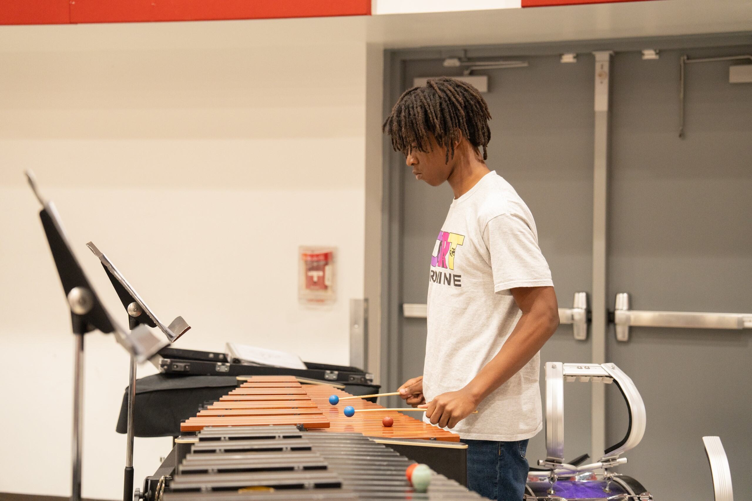 Student playing percussion