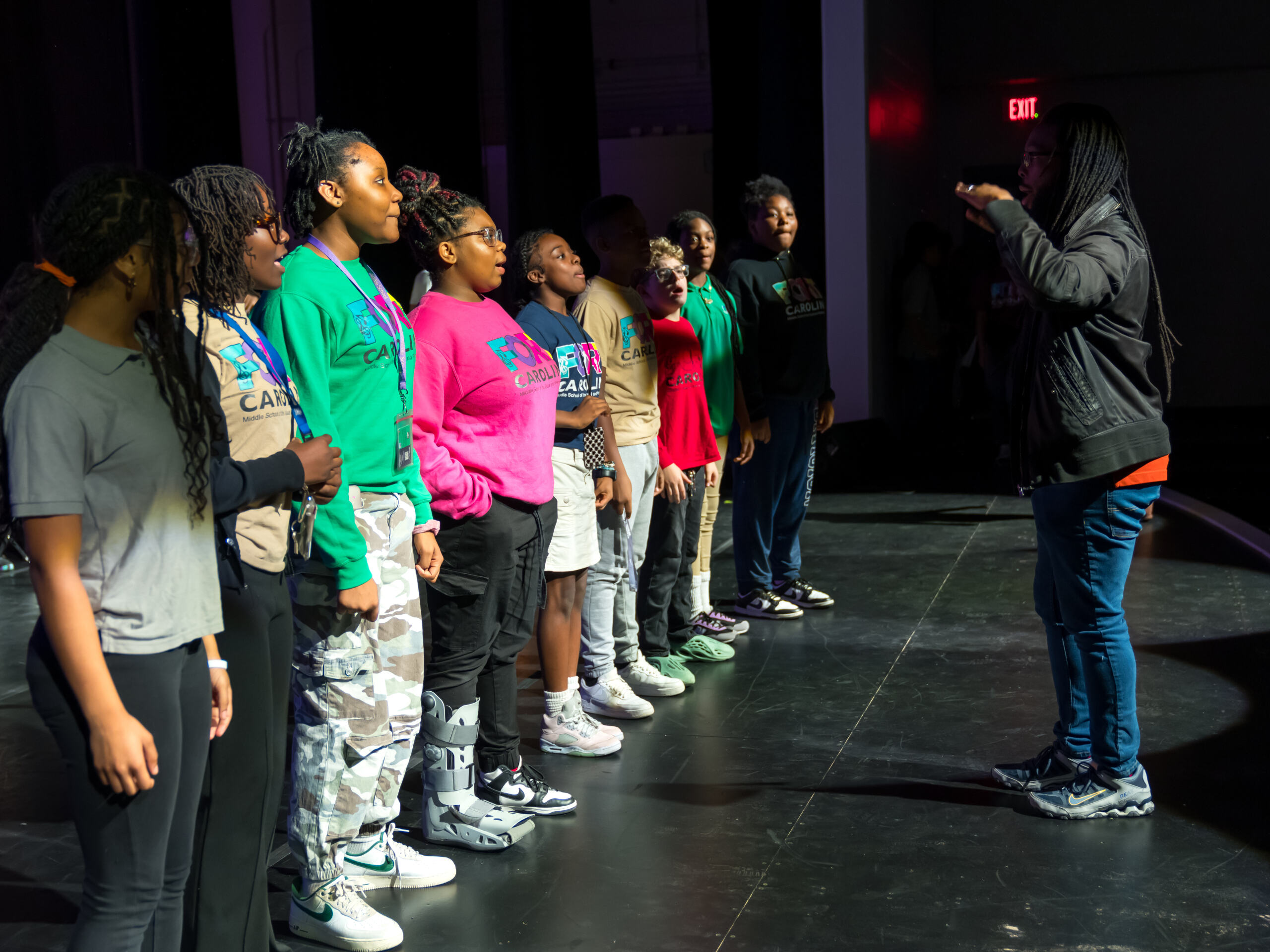Students in a line on stage