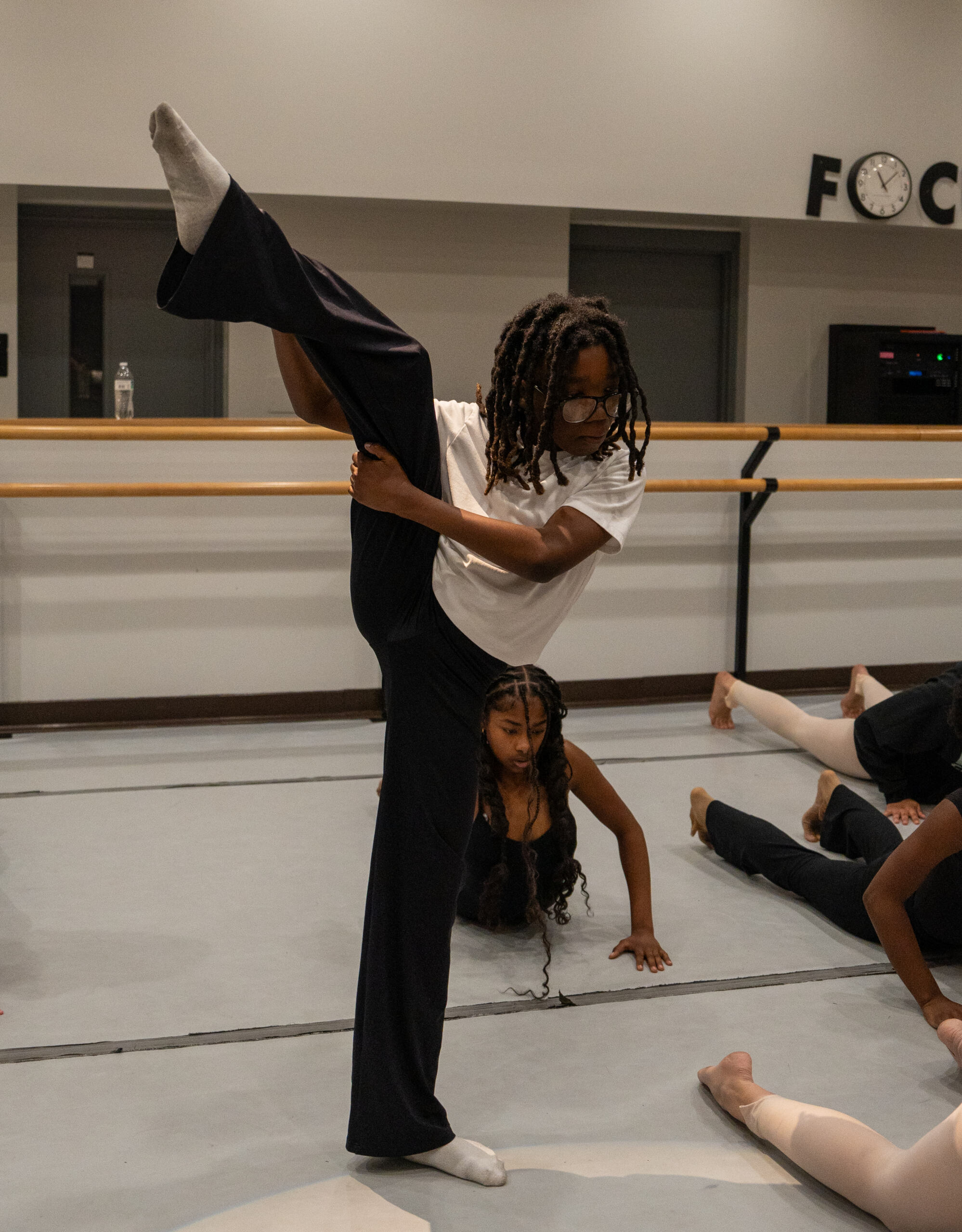 A student dancing in dance class