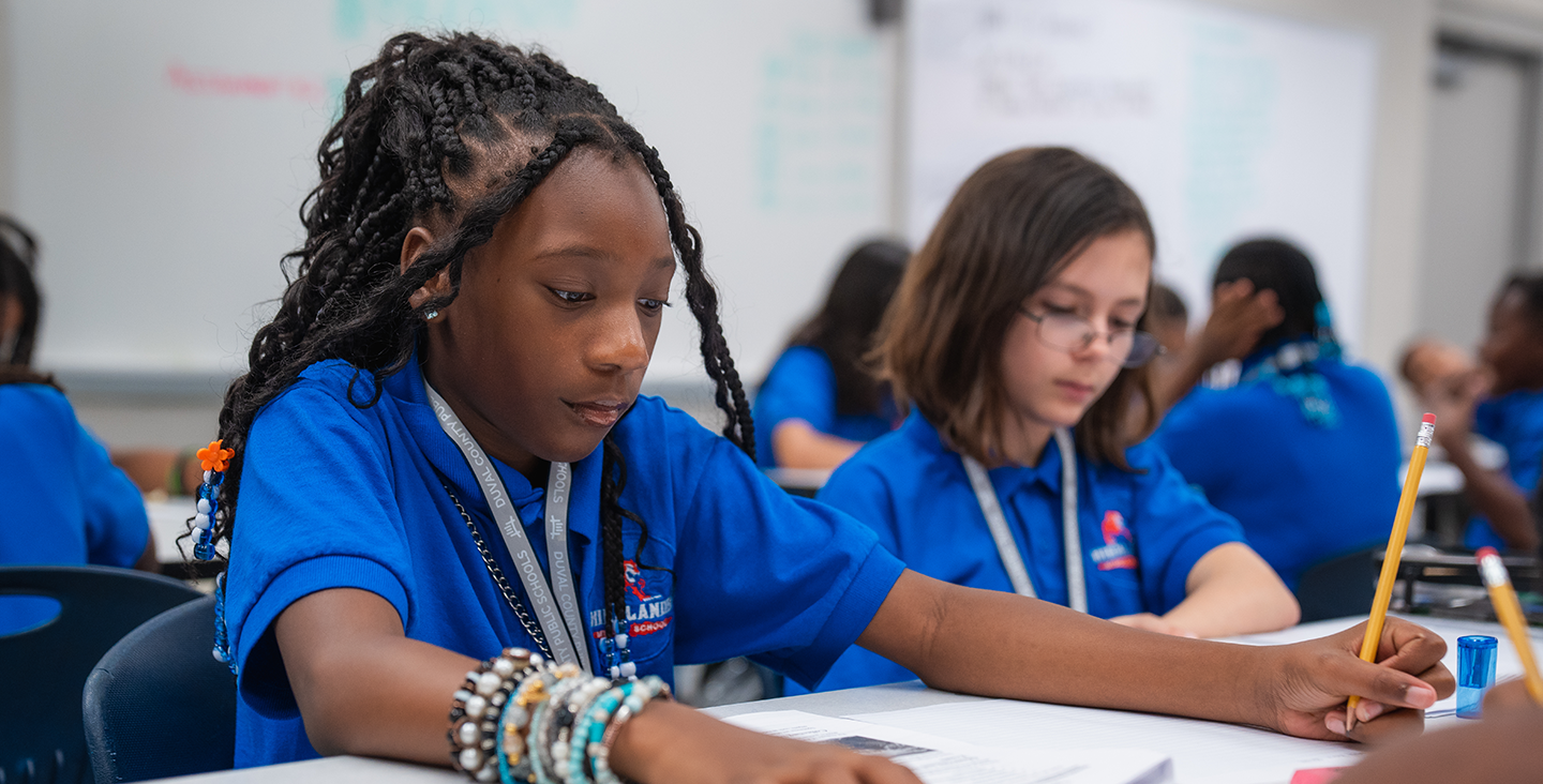 Students writing at their desks