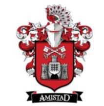 The Amistad logo. A red and white coat of arms with intricate designs features a castle, keys, and a helmet with a peacock feather.