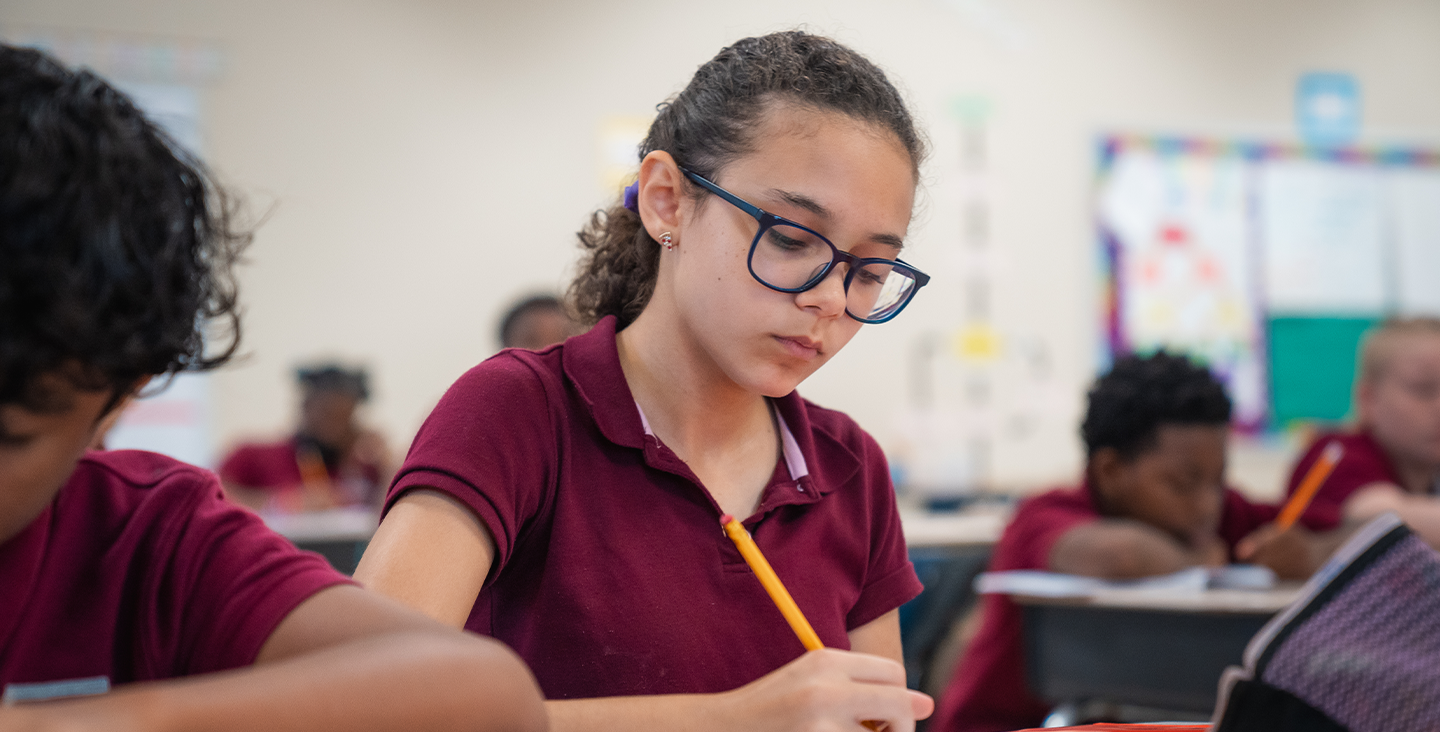 student working on an assignment in class