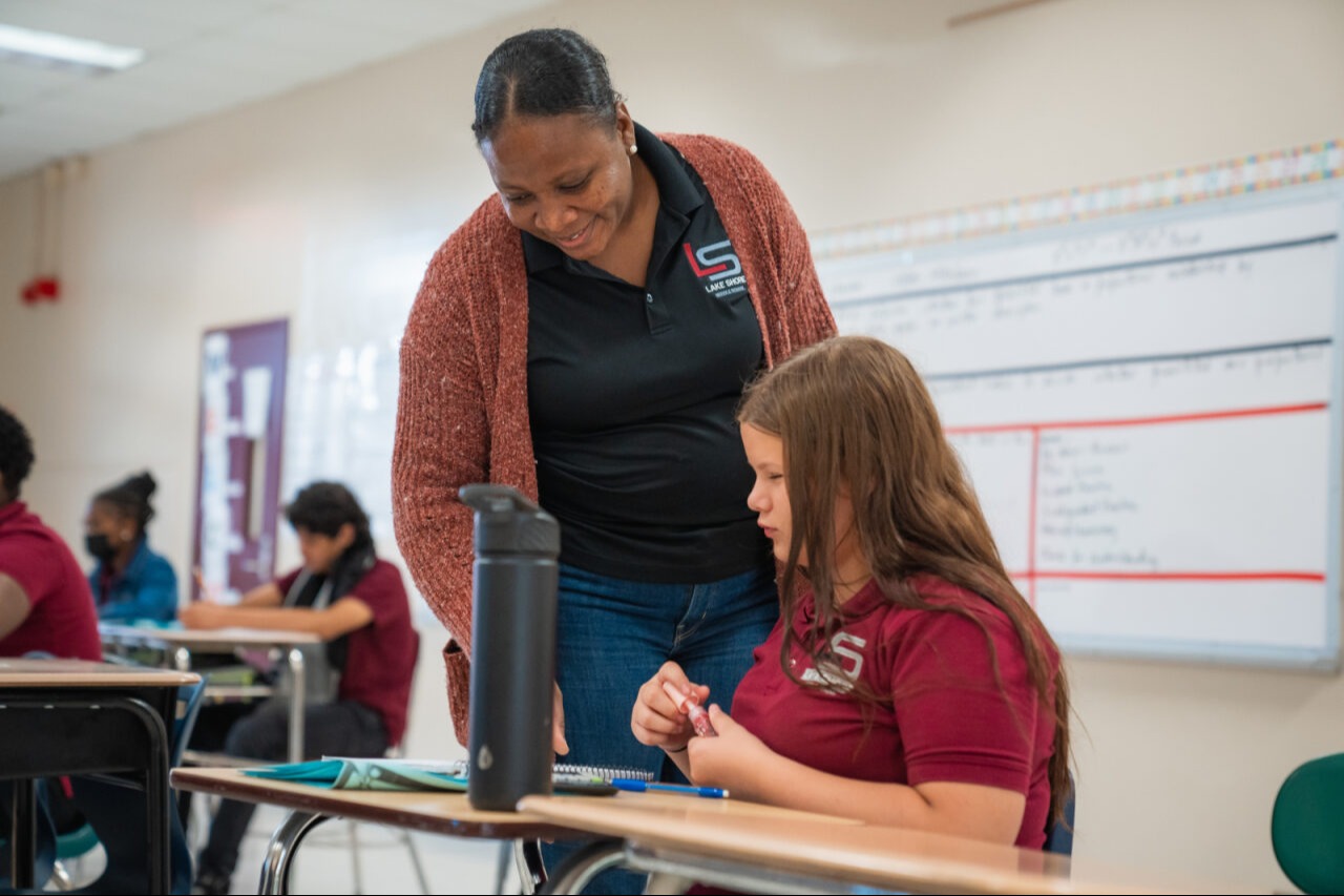 Teacher helping a student