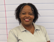 A smiling woman in a light-colored polo shirt poses against a lined background with red and blue lines.