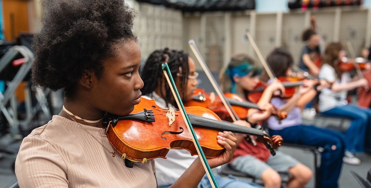 Children playing the violin