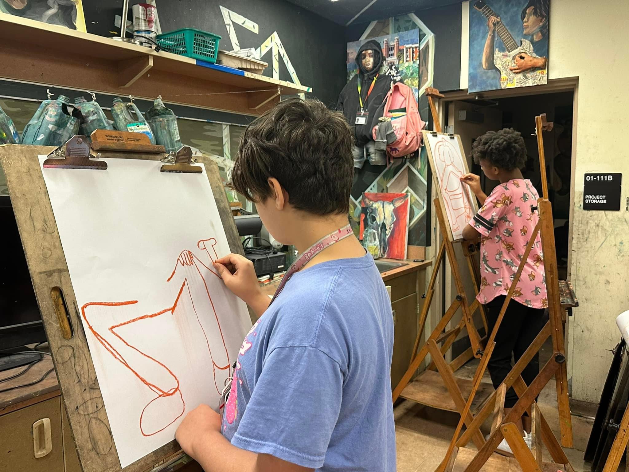 Student at drawing easel