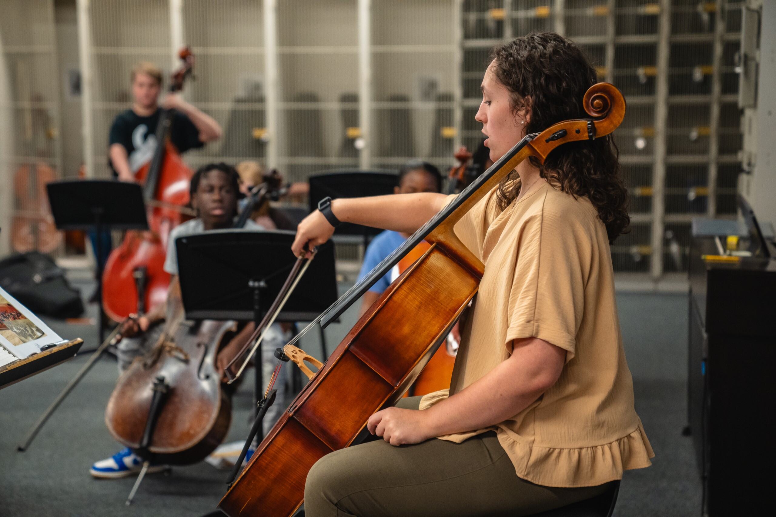 Teacher playing string instrument