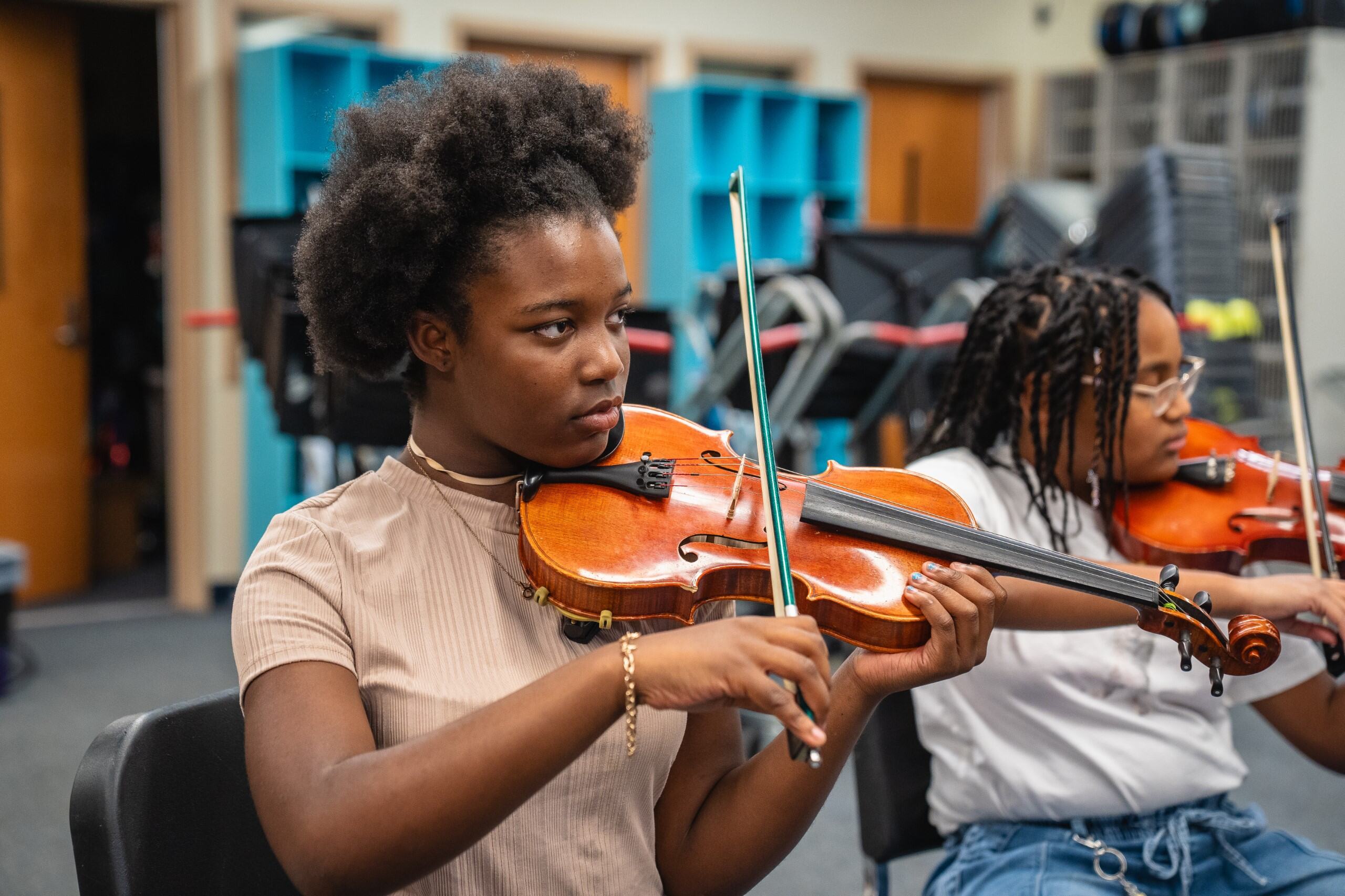 close up of student playing violin