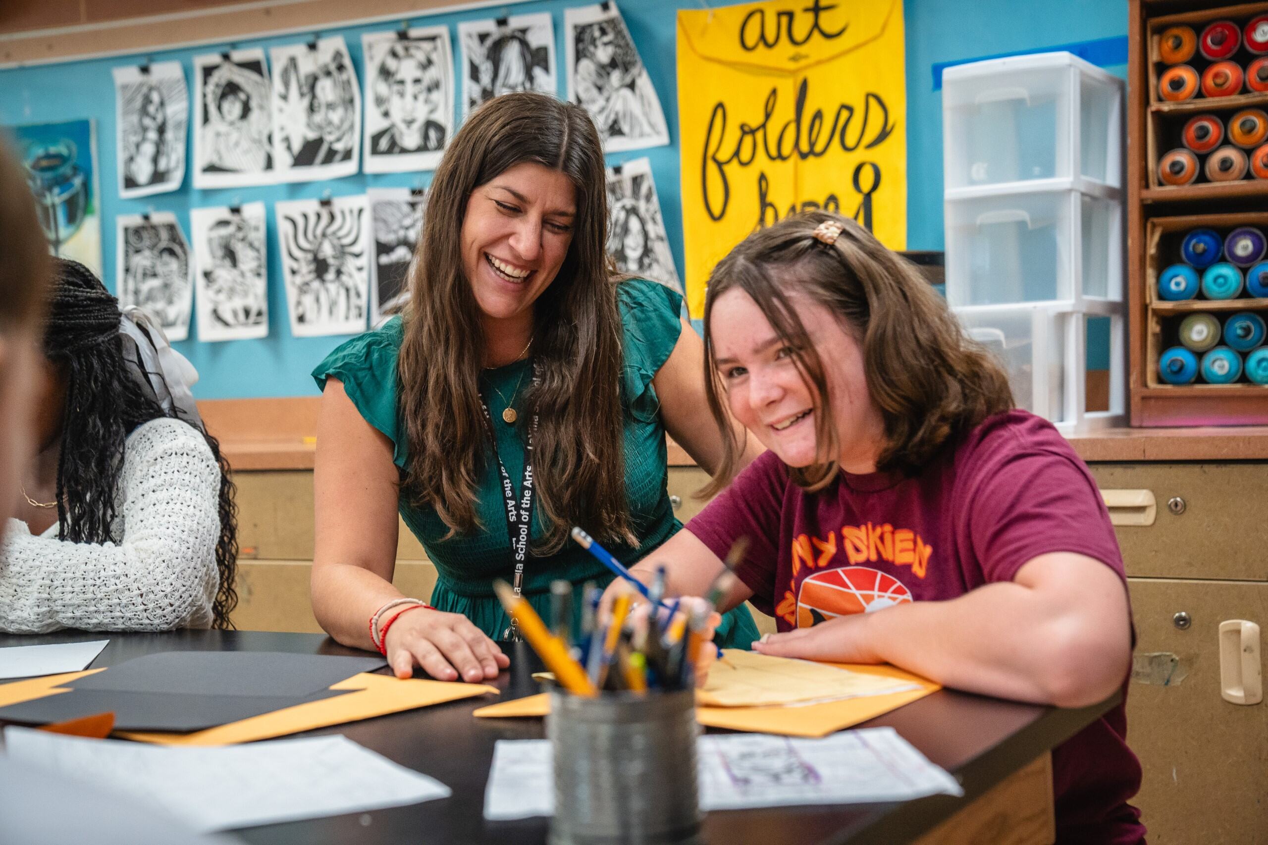 Teacher and student in art class