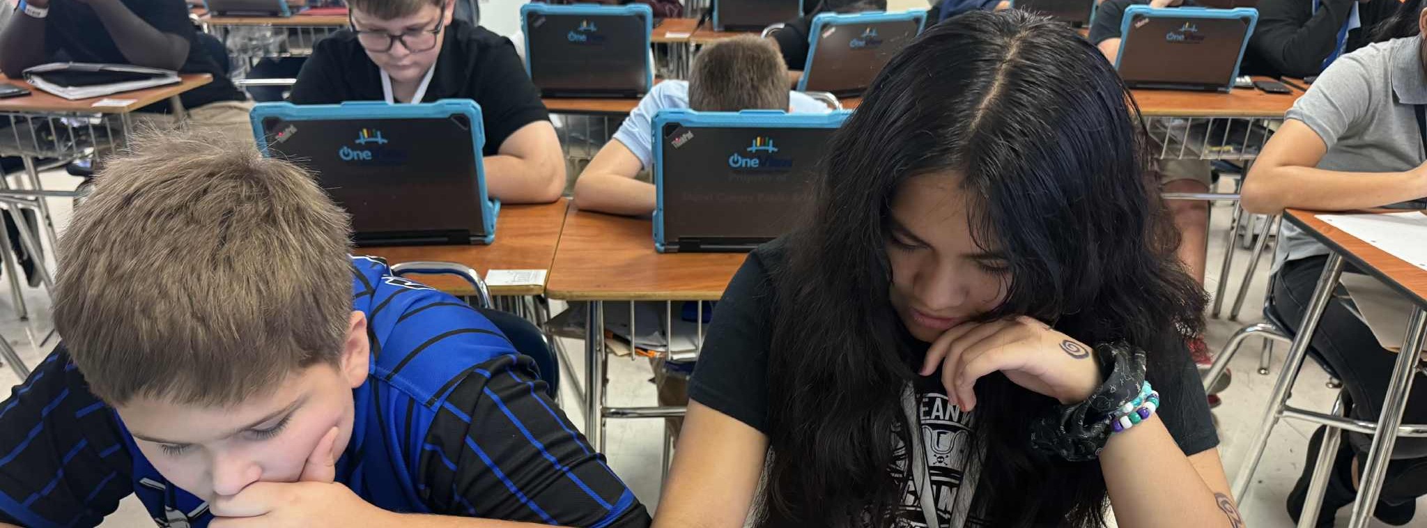 students working on a laptop