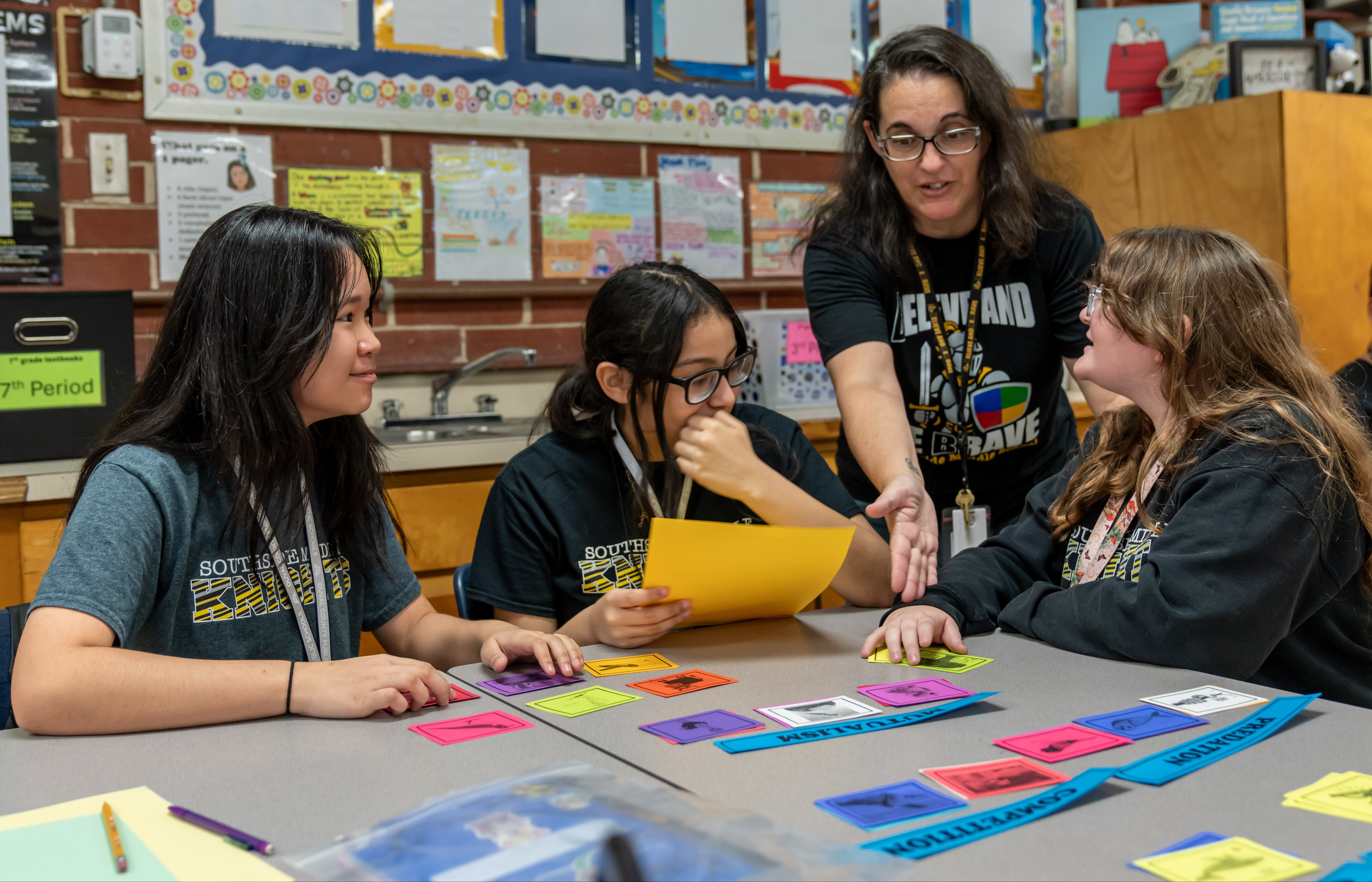 kids working together with the teacher on an activity