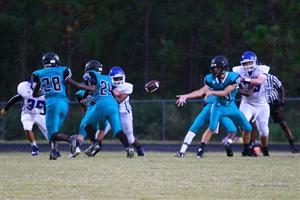 students playing football