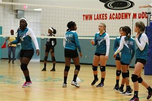 students playing volleyball