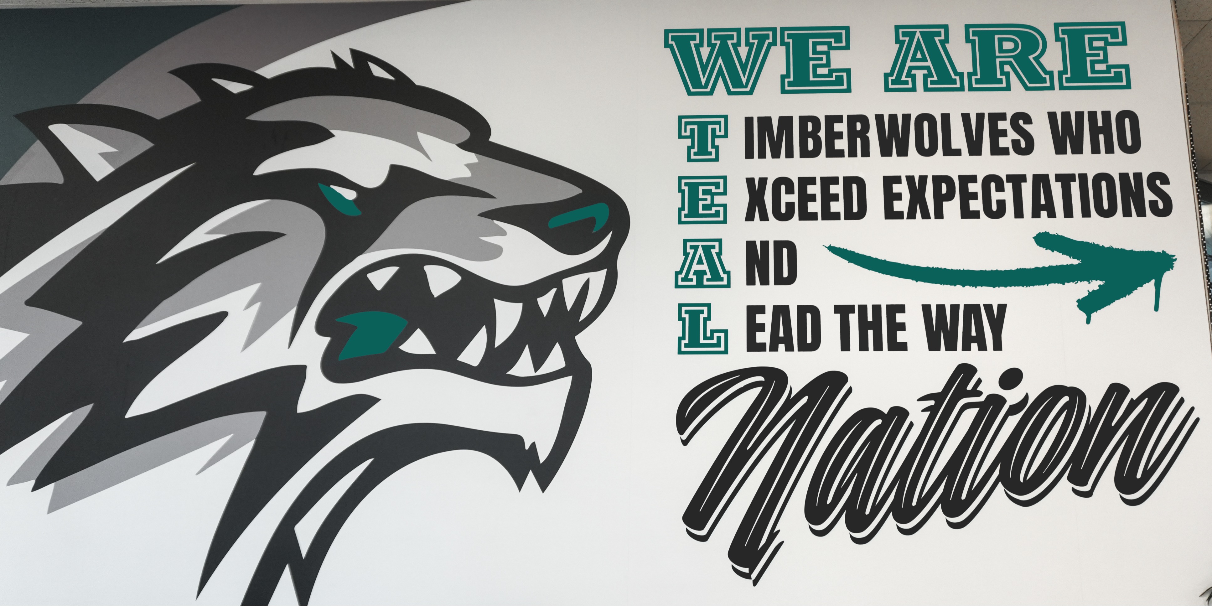 two students working at a table in a classroom