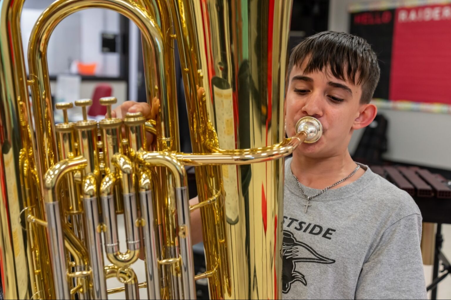 Student playing an instrument