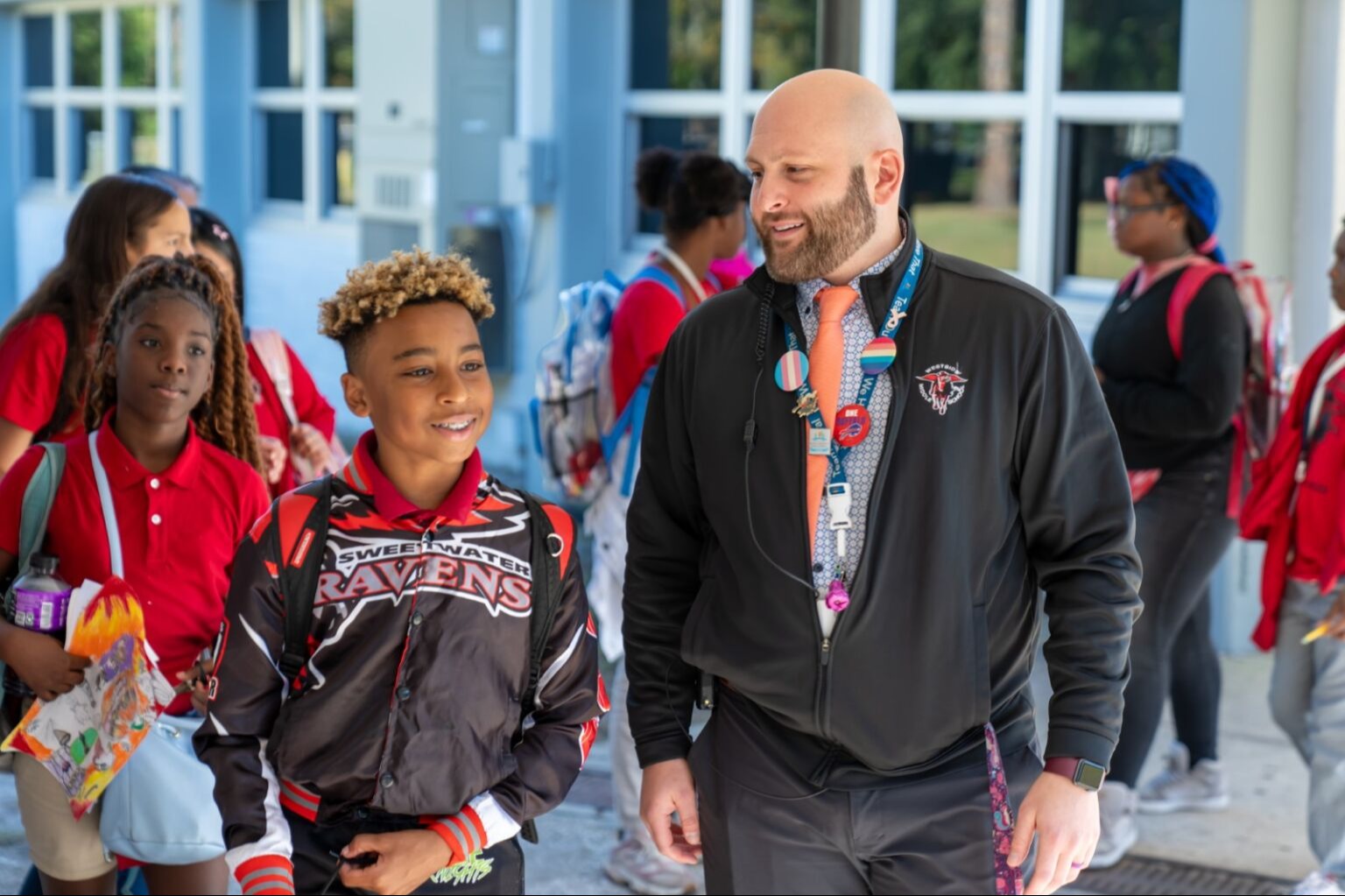 Student walking with the principal