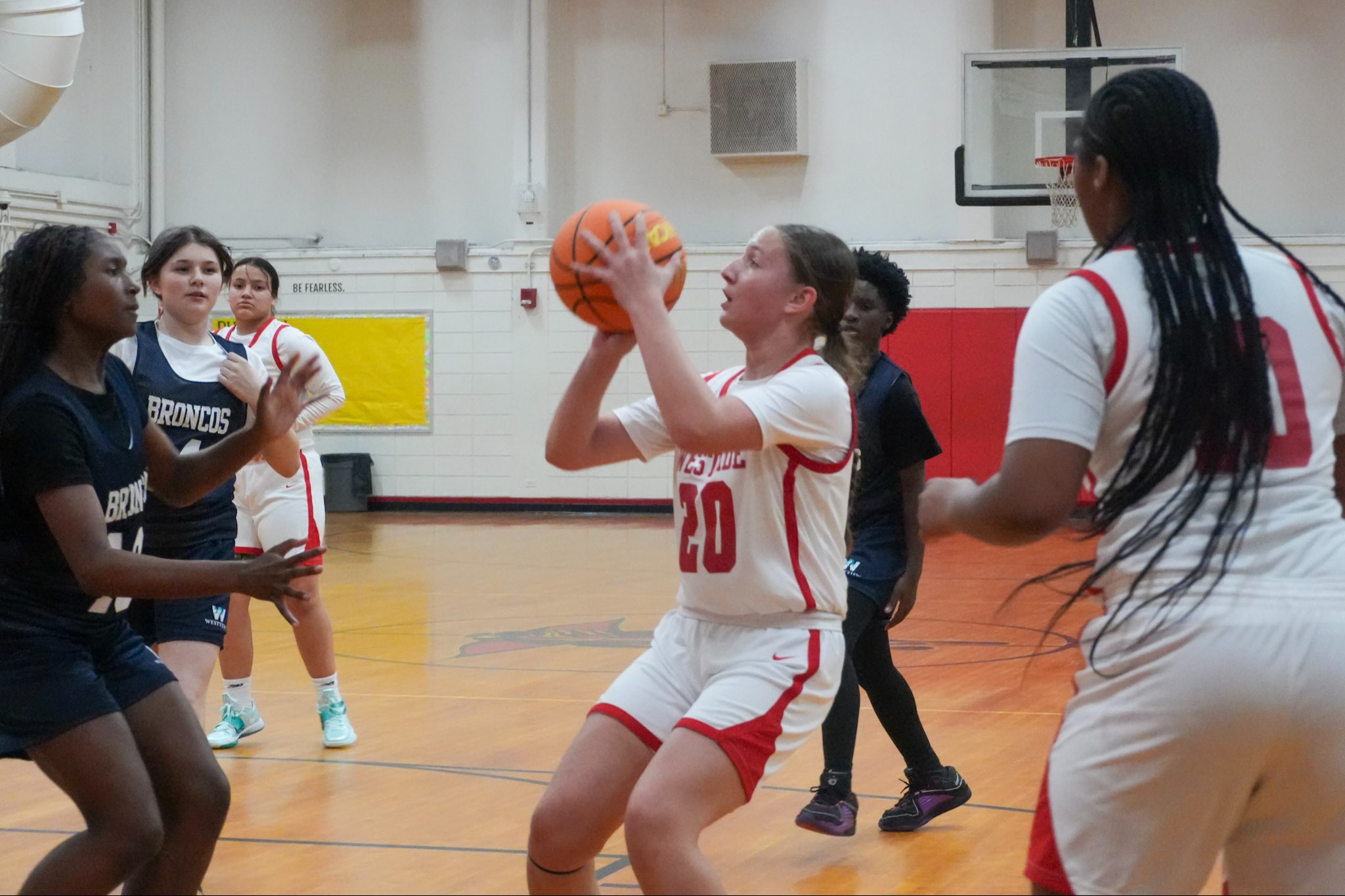 Girl shootinga basketball