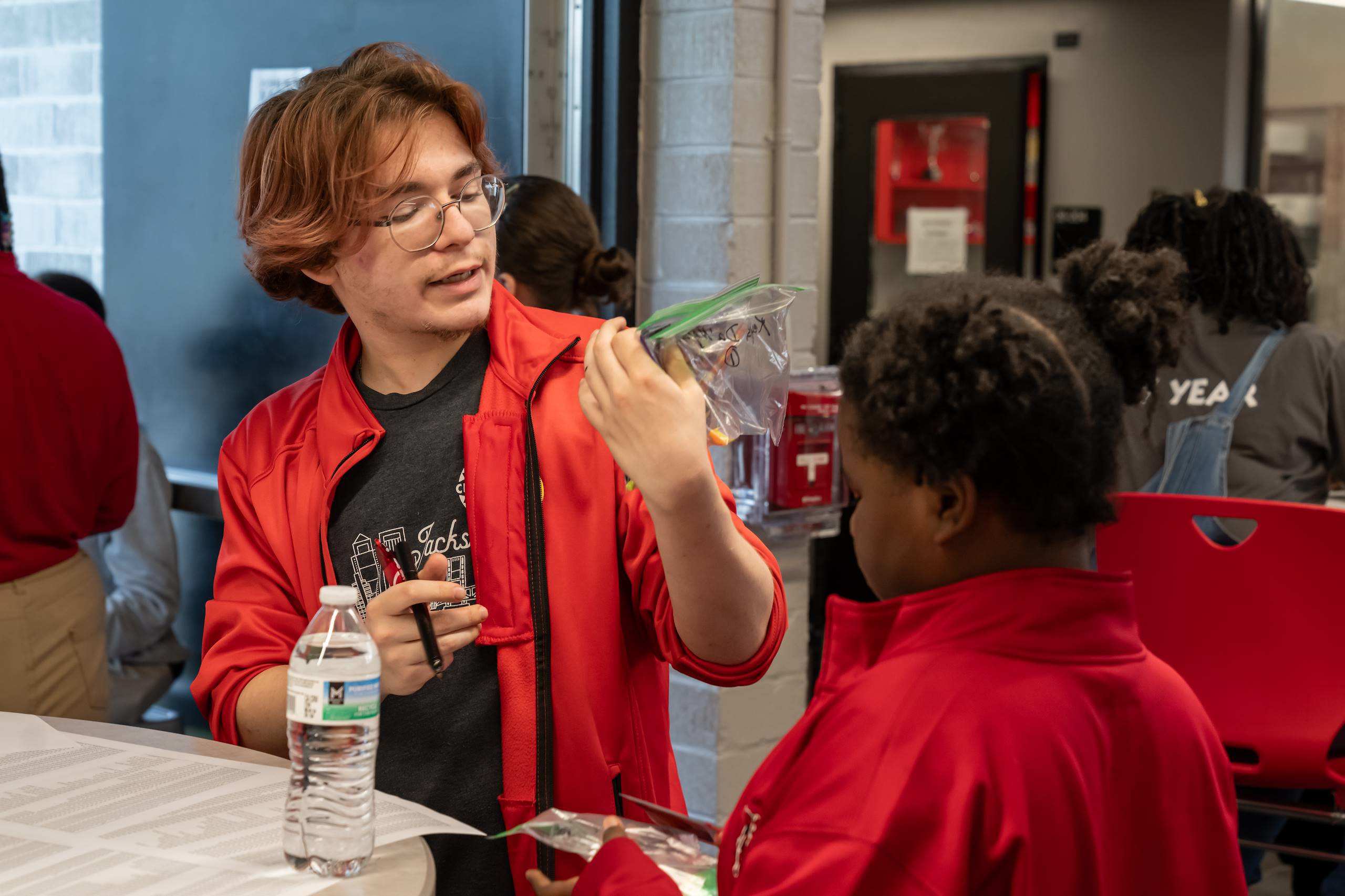 A cityyear employee working with a student