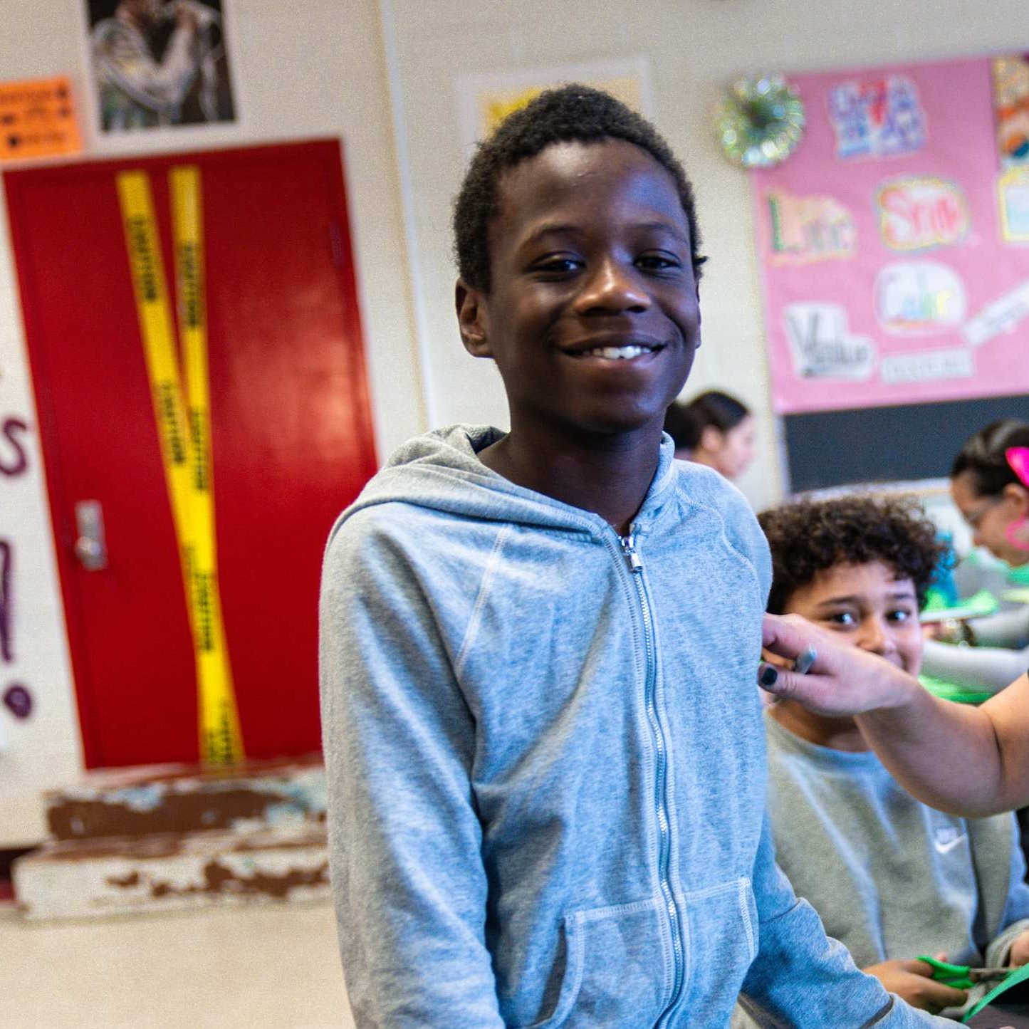 Student smiling at the camera