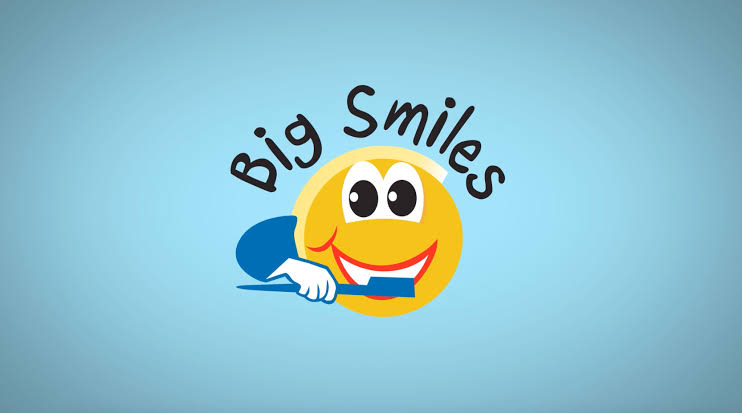 A yellow smiley face with eyes and a toothbrush in its hand. Text reads "Big Smiles" in black.