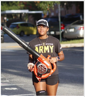 student holding a blower