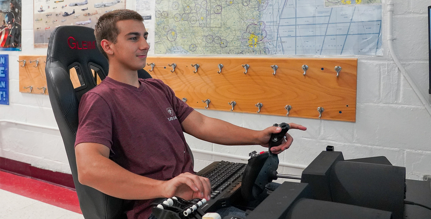 Student operating a gaming device