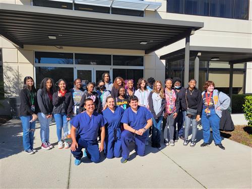 group of med students outside a hospital, posing