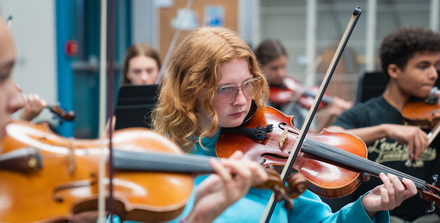 Students playing violins