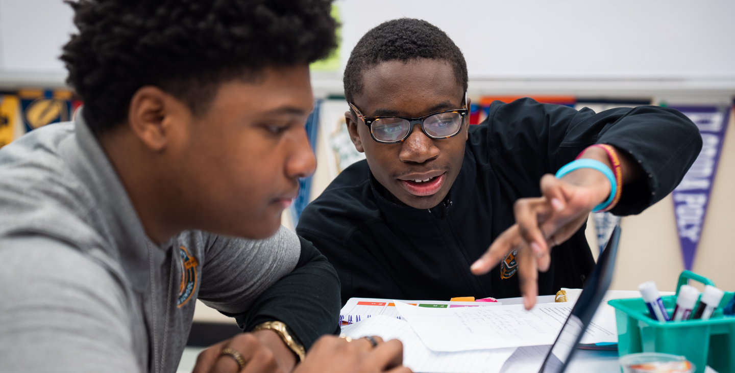 Two students working together on classwork