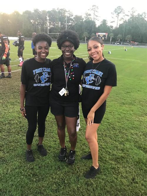 three teenagers at a sports school event