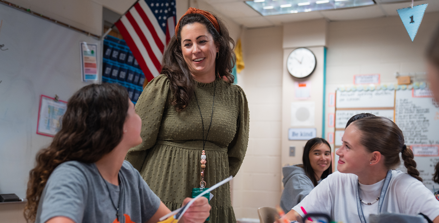 teacher speaking with students