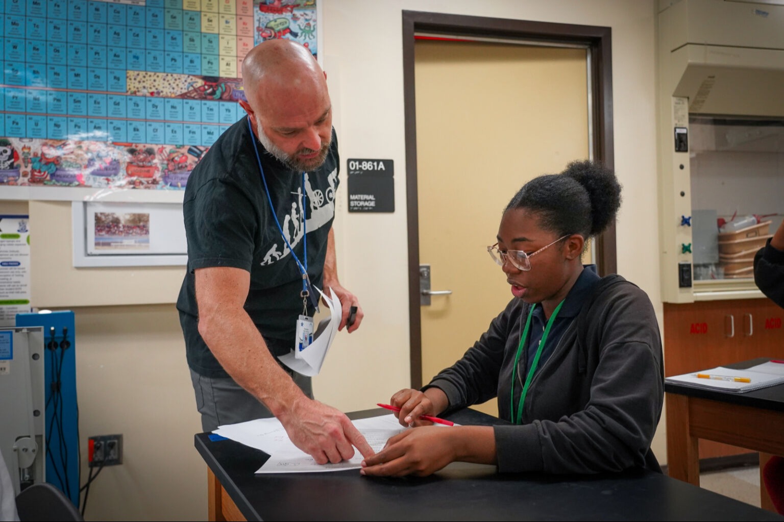 Teacher helping a student