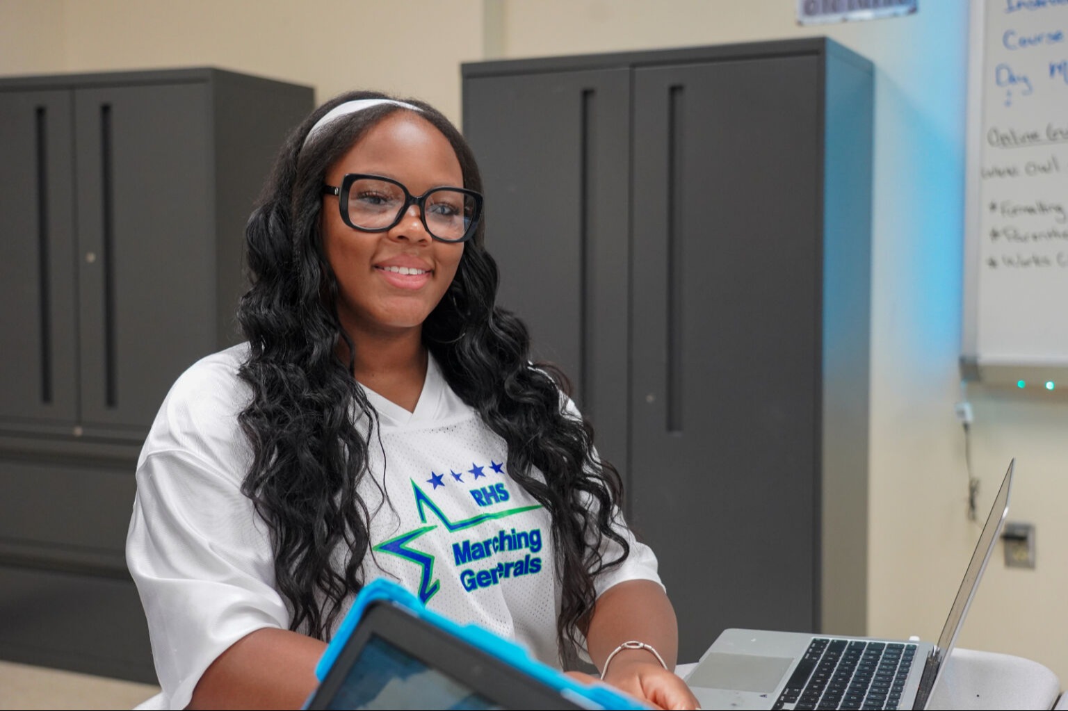 Student smiling at the camera
