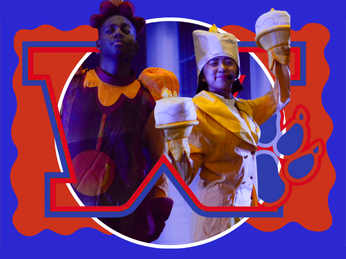 Two performers in costumes stand before a blue and orange background with a paw print. One wears a purple jester outfit; the other wears a yellow chef's uniform.