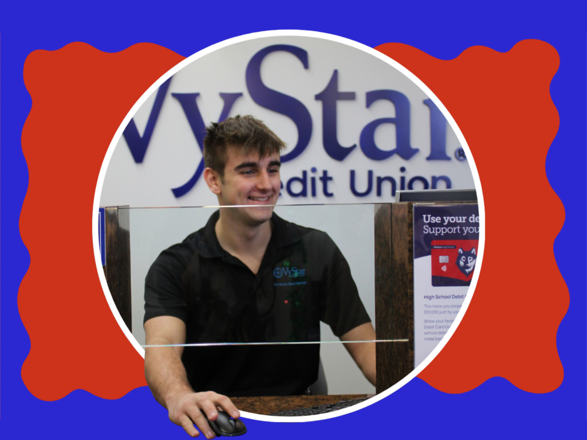 A person in a black shirt uses a computer at a desk. A red-and-blue background surrounds the image.