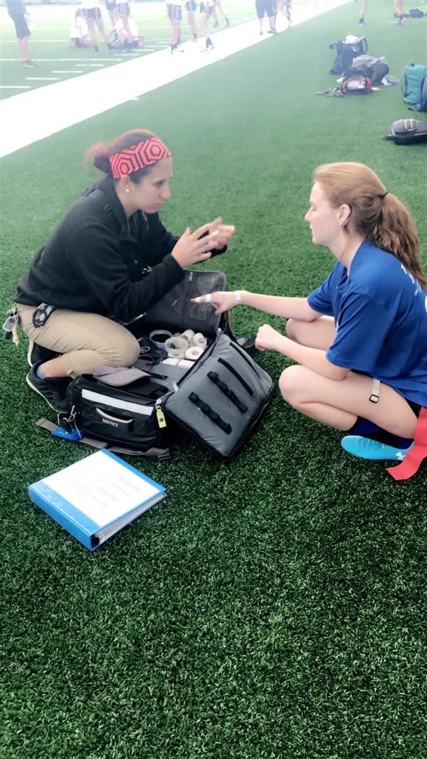 Medical staff assisting athlete