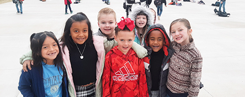 students smiling outside