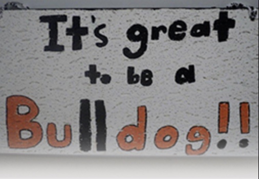 hand-lettered sign reading "It's great to be a bulldog." 