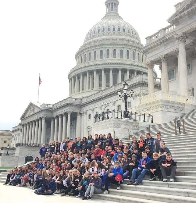 group of students outside of the city hall