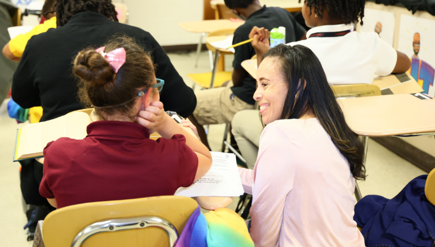 image of volunteer with a student 