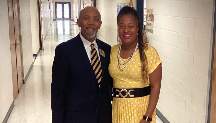 Image of Dr. Connelly and Dr. Backman standing in the school hallway.