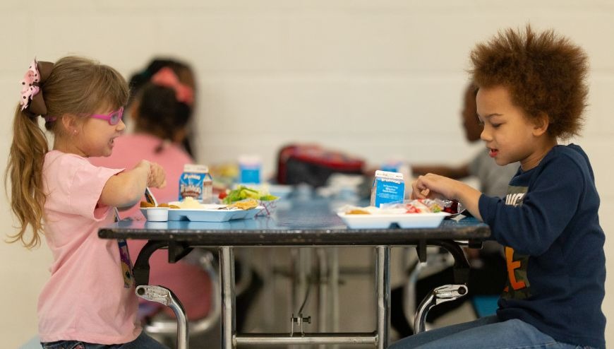 students in cafeteria eating