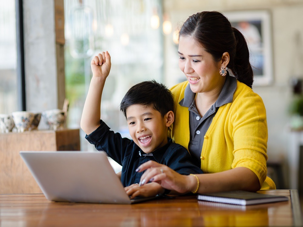 Student and mother at labtop