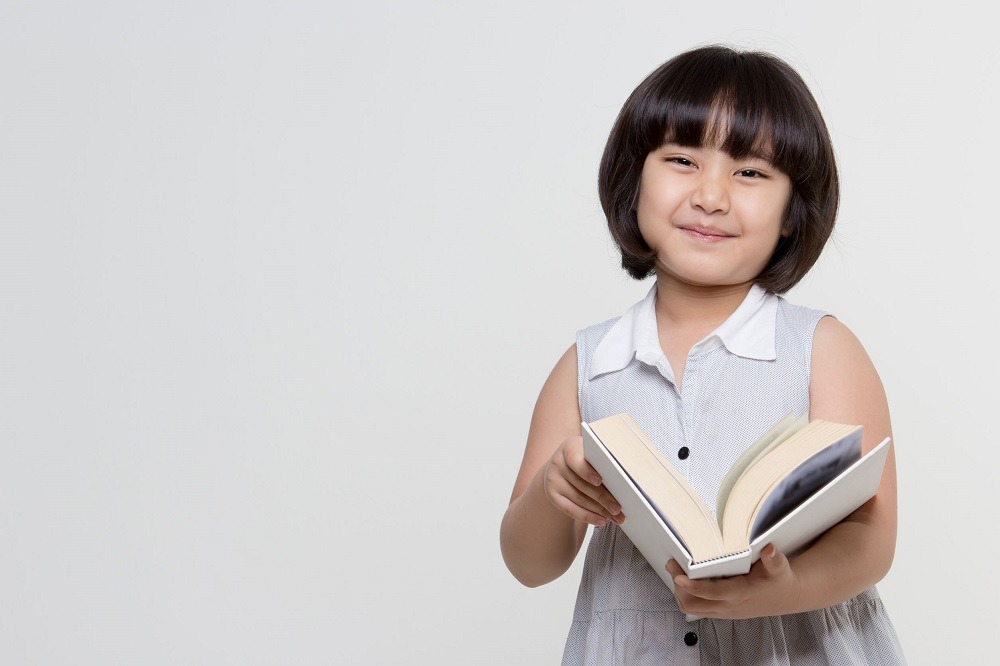 girl holding book