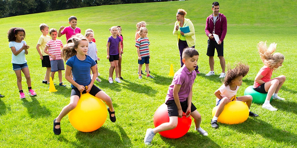 kid jumping on bouncy balls