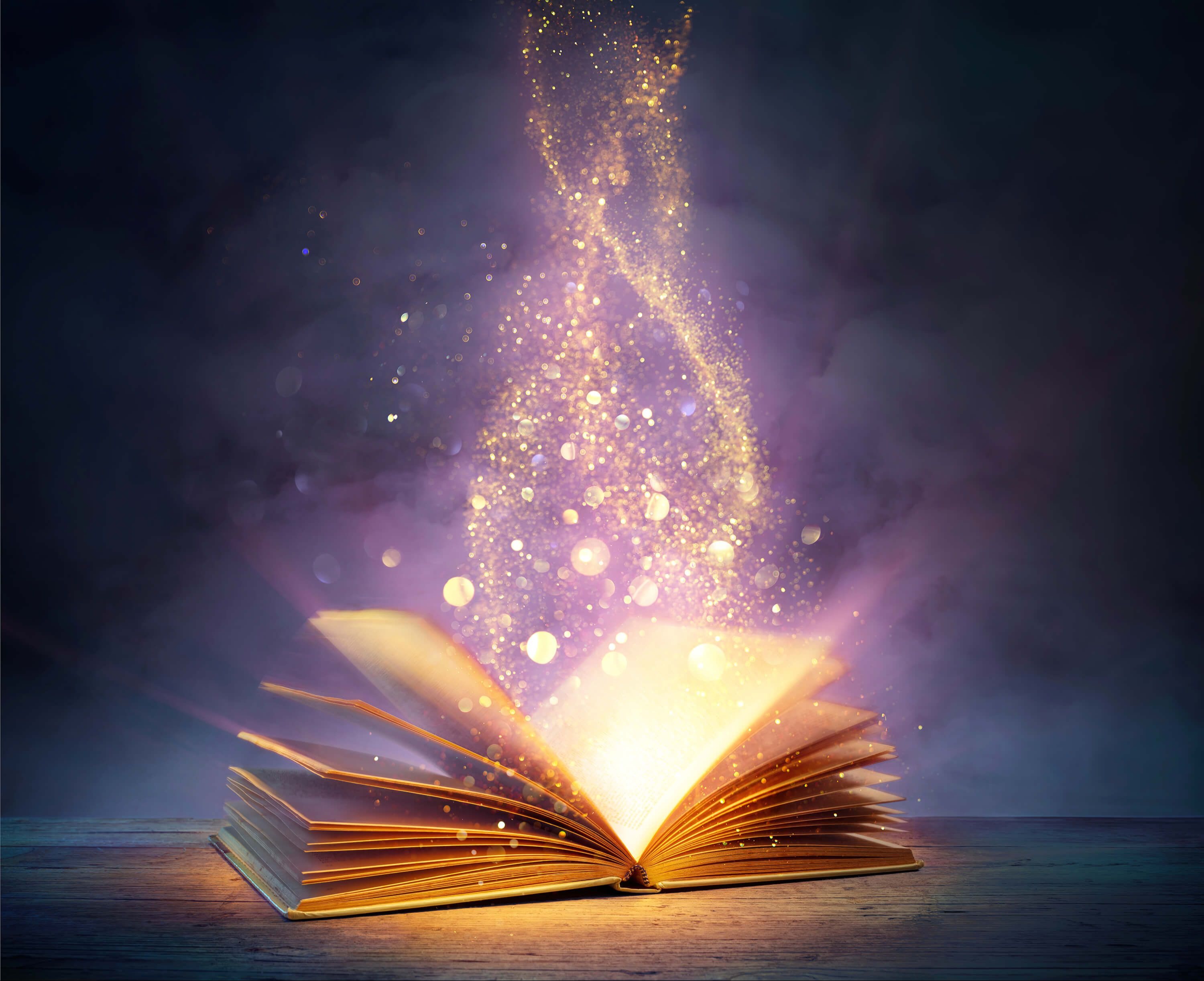book open with sparks