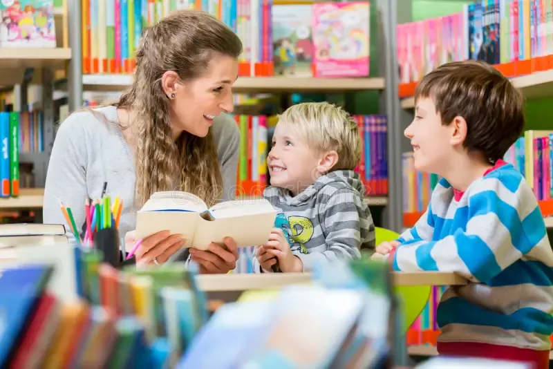 mom reading with two kids