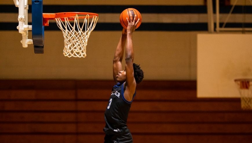 Image of basketball player dunking a ball