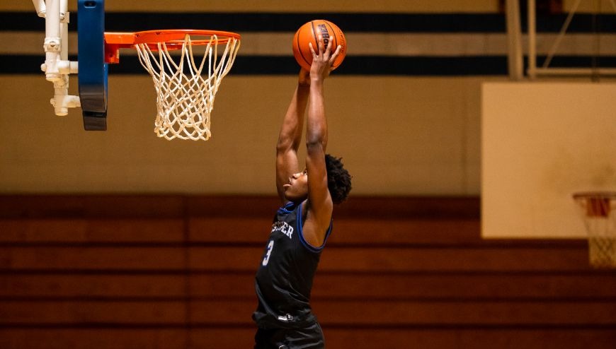 Image of basketball player dunking a ball